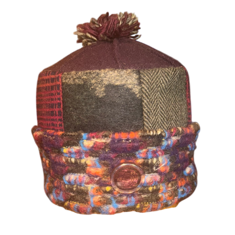 Multicolored beanie with a patterned design on a white background